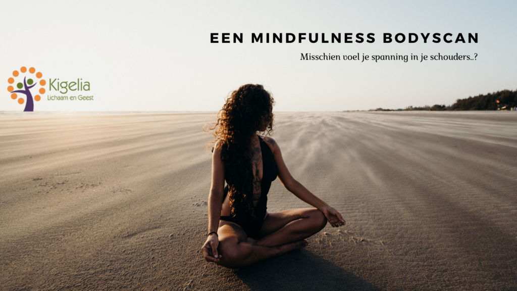 A woman sitting on a sandy beach meditating. A mindfulness bodyscan.